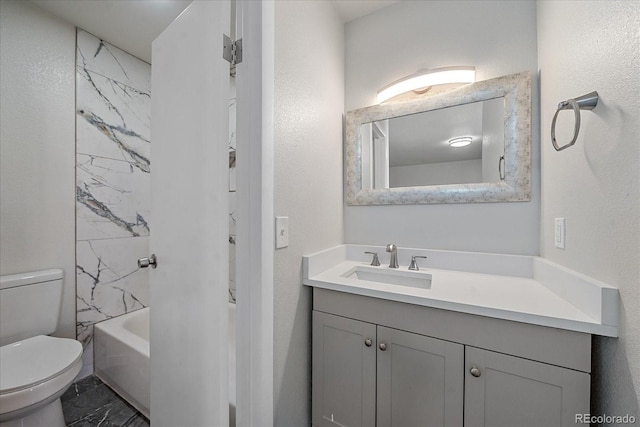 full bathroom with vanity, toilet, and tiled shower / bath