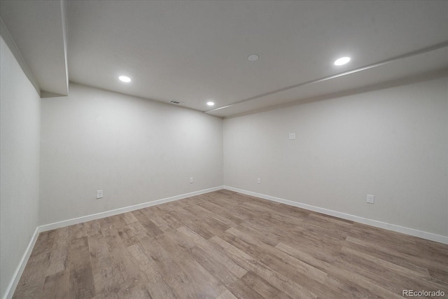 unfurnished room with light hardwood / wood-style floors