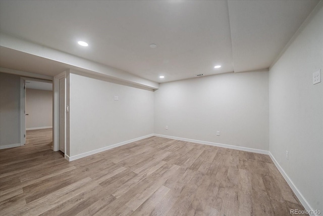 basement featuring light wood-type flooring