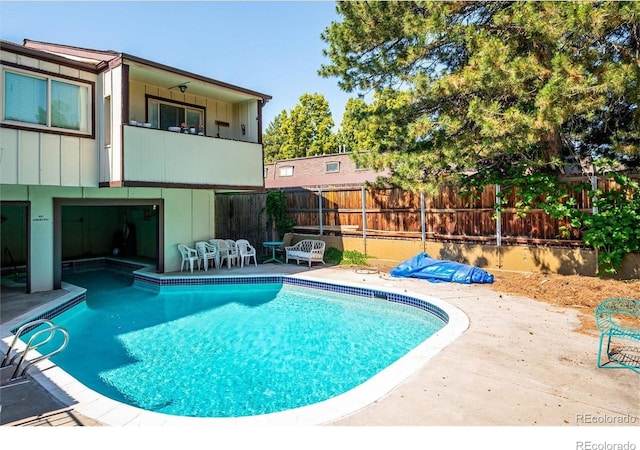 view of pool featuring a patio