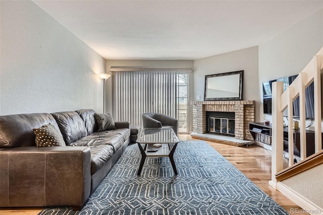 1818 S Quebec Way Unit 11-8, Denver, CO 80231 - living room with wood finished floors and a fireplace