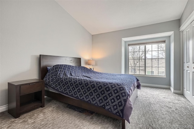 1818 S Quebec Way Unit 11-8, Denver, CO 80231 - bedroom with baseboards, carpet, and vaulted ceiling