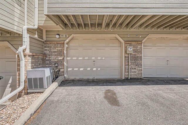 1818 S Quebec Way Unit 11-8, Denver, CO 80231 - garage with cooling unit