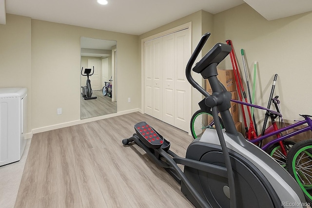 1818 S Quebec Way Unit 11-8, Denver, CO 80231 - workout room featuring baseboards, recessed lighting, washer / clothes dryer, and wood finished floors