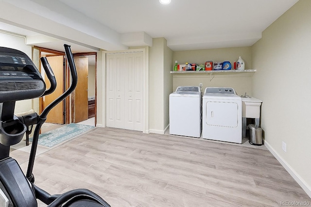 1818 S Quebec Way Unit 11-8, Denver, CO 80231 - laundry room with separate washer and dryer, laundry area, baseboards, and wood finished floors