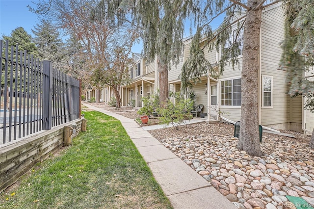 1818 S Quebec Way Unit 11-8, Denver, CO 80231 - view of community featuring fence and a yard