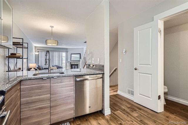 1818 S Quebec Way Unit 11-8, Denver, CO 80231 - kitchen with dishwasher, dark wood-style flooring, light stone counters, and pendant lighting