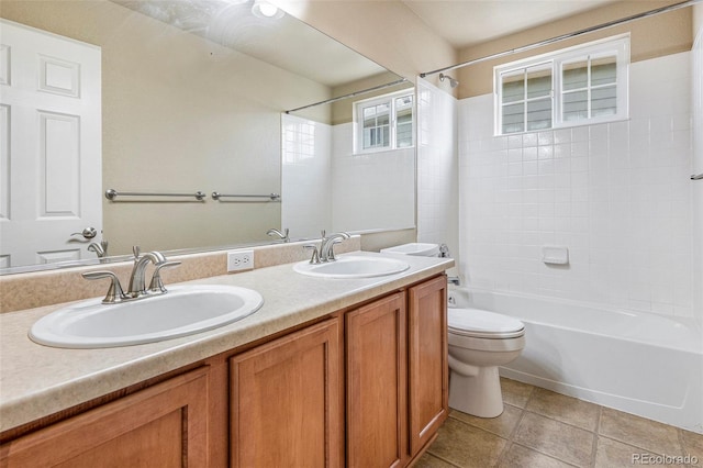 bathroom with toilet, shower / tub combination, double vanity, and a sink