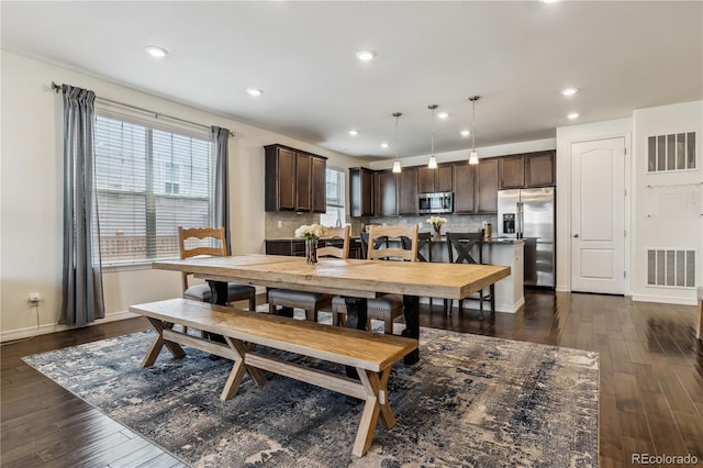 dining room with recessed lighting, visible vents, and dark wood finished floors