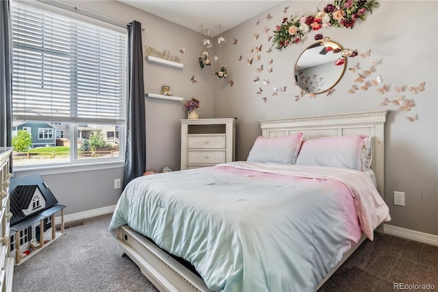 carpeted bedroom featuring baseboards and visible vents