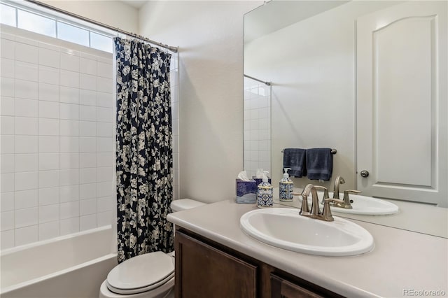bathroom featuring vanity, toilet, and shower / bathtub combination with curtain