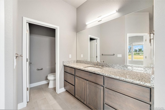 7293 Xenophon Ct, Arvada, CO 80004 - bathroom featuring vanity and tile patterned flooring