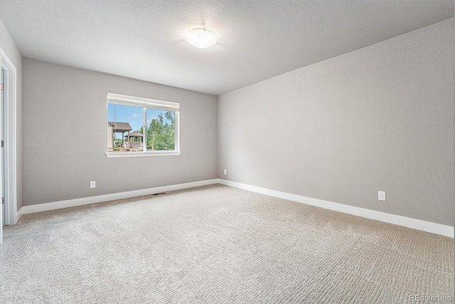 7293 Xenophon Ct, Arvada, CO 80004 - spare room featuring light carpet and a textured ceiling