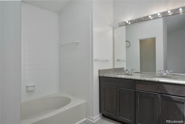 bathroom featuring vanity and tub / shower combination