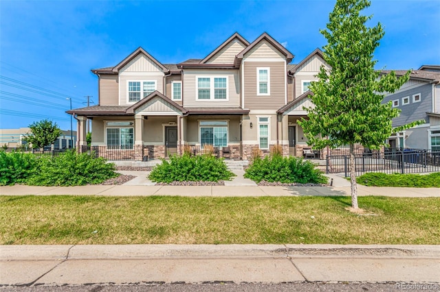 3805 N Himalaya Rd Unit 1, Denver, CO 80249 - craftsman inspired home featuring a porch, stone siding, and board and batten siding