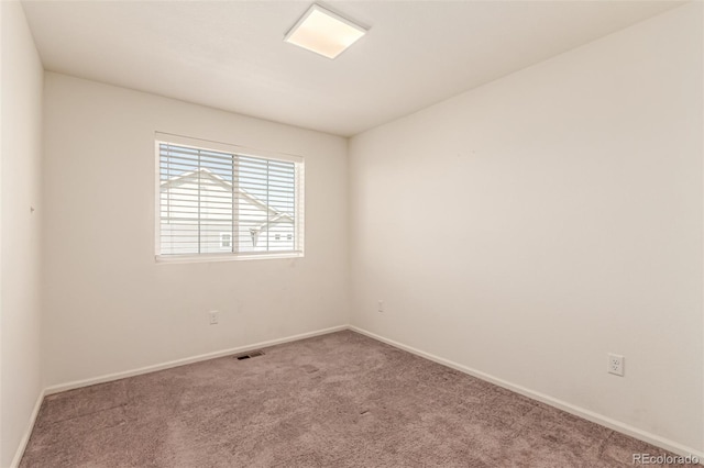 3805 N Himalaya Rd Unit 1, Denver, CO 80249 - spare room with carpet flooring and baseboards