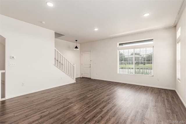 3805 N Himalaya Rd Unit 1, Denver, CO 80249 - unfurnished living room with stairs, dark wood finished floors, and recessed lighting