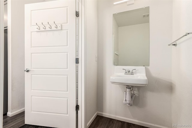 3805 N Himalaya Rd Unit 1, Denver, CO 80249 - bathroom with baseboards and wood finished floors