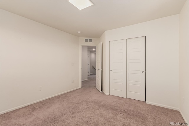 3805 N Himalaya Rd Unit 1, Denver, CO 80249 - unfurnished bedroom featuring light carpet and a closet