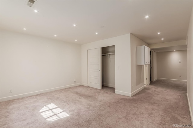 3805 N Himalaya Rd Unit 1, Denver, CO 80249 - unfurnished bedroom featuring light carpet, recessed lighting, and a closet