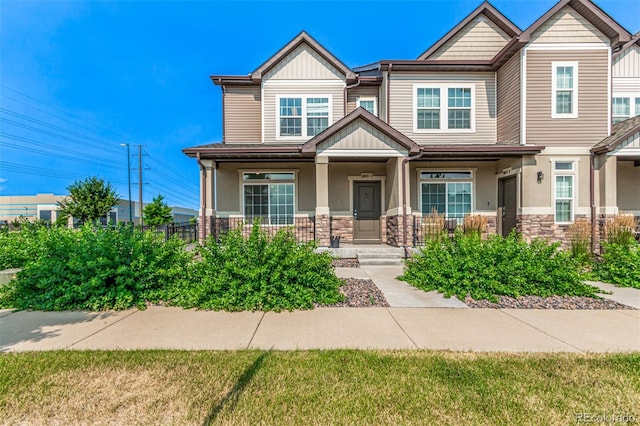 3805 N Himalaya Rd Unit 1, Denver, CO 80249 - craftsman house with covered porch and stone siding