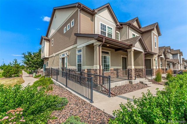 3805 N Himalaya Rd Unit 1, Denver, CO 80249 - view of home's exterior featuring stone siding, stucco siding, and board and batten siding