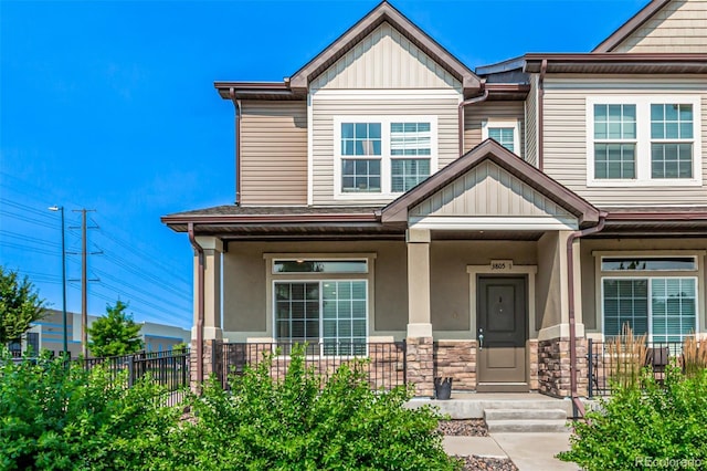 3805 N Himalaya Rd Unit 1, Denver, CO 80249 - craftsman inspired home with a porch, board and batten siding, and stone siding