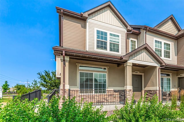 3805 N Himalaya Rd Unit 1, Denver, CO 80249 - craftsman-style house with a porch, stone siding, board and batten siding, and stucco siding