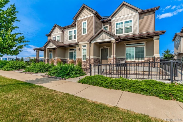 3805 N Himalaya Rd Unit 1, Denver, CO 80249 - craftsman-style home with stone siding, a porch, and board and batten siding