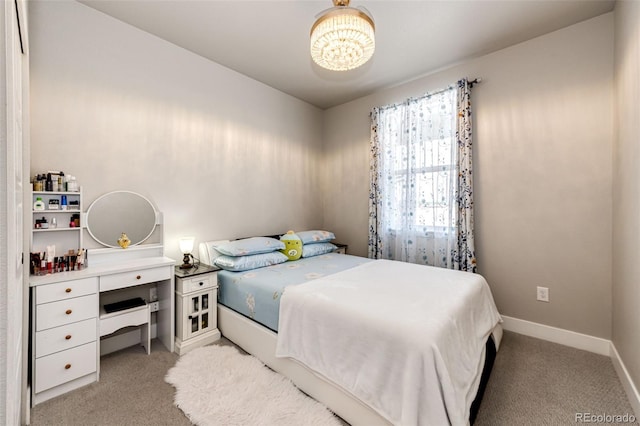 3722 Sandy Vista Trl, Castle Rock, CO 80104 - bedroom featuring light carpet, a chandelier, and baseboards