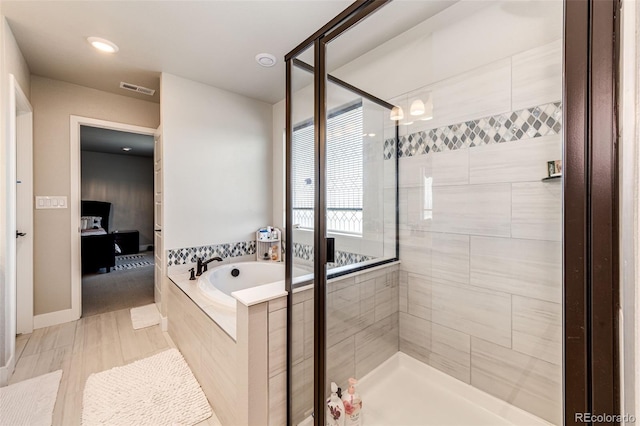 3722 Sandy Vista Trl, Castle Rock, CO 80104 - ensuite bathroom with a garden tub and a stall shower