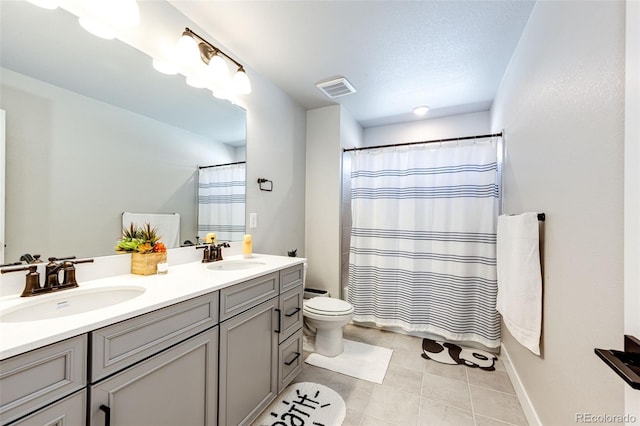 3722 Sandy Vista Trl, Castle Rock, CO 80104 - full bath with double vanity, toilet, tile patterned flooring, and a shower with shower curtain