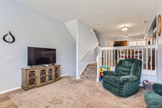 8199 Welby Rd Unit 3102, Denver, CO 80229 - living area featuring stairway, baseboards, and carpet