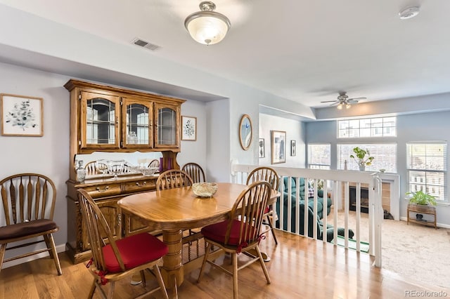 8199 Welby Rd Unit 3102, Denver, CO 80229 - dining area featuring healthy amount of natural light, ceiling fan, and light wood-style flooring