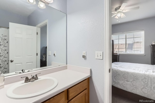 8199 Welby Rd Unit 3102, Denver, CO 80229 - ensuite bathroom with vanity, ceiling fan, and a textured wall