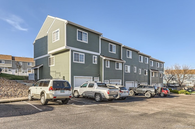 8199 Welby Rd Unit 3102, Denver, CO 80229 - view of property with uncovered parking and a residential view