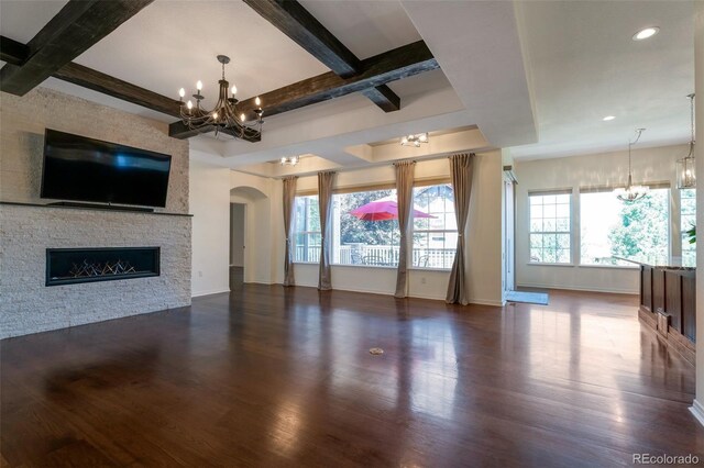24733 E Park Crescent Dr, Aurora, CO 80016 - unfurnished living room featuring a chandelier, wood finished floors, healthy amount of natural light, beam ceiling, and recessed lighting