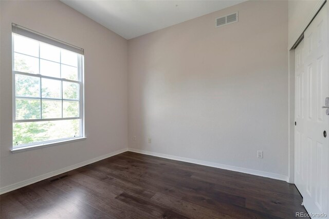 24733 E Park Crescent Dr, Aurora, CO 80016 - unfurnished room with healthy amount of natural light and dark wood-style flooring