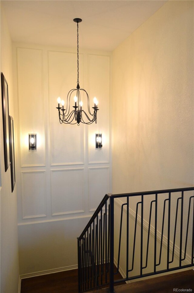 24733 E Park Crescent Dr, Aurora, CO 80016 - stairs featuring a chandelier and wood finished floors
