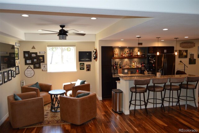 24733 E Park Crescent Dr, Aurora, CO 80016 - indoor wet bar with black fridge with ice dispenser, dark wood-style flooring, hanging light fixtures, a ceiling fan, and recessed lighting