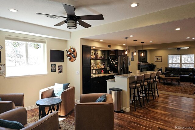 24733 E Park Crescent Dr, Aurora, CO 80016 - indoor wet bar with freestanding refrigerator, dark wood-type flooring, ceiling fan, recessed lighting, and pendant lighting