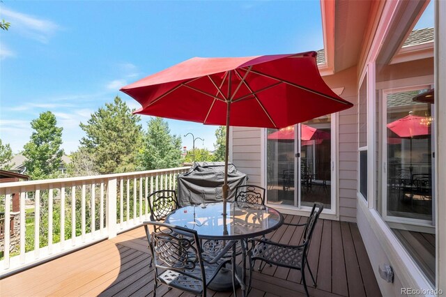 24733 E Park Crescent Dr, Aurora, CO 80016 - wooden terrace with outdoor dining area