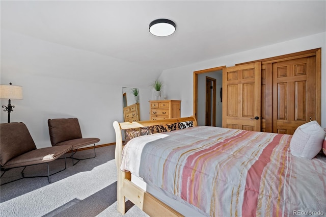 carpeted bedroom featuring lofted ceiling