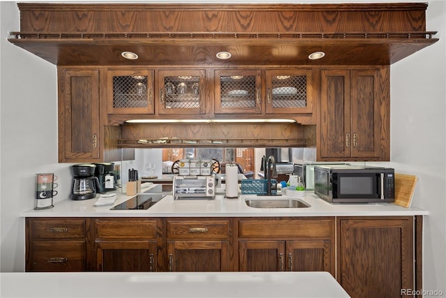 kitchen featuring sink and black electric cooktop