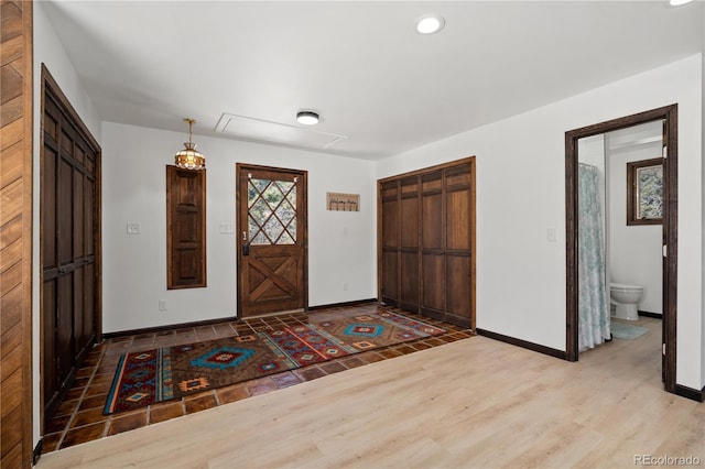 entryway with hardwood / wood-style floors