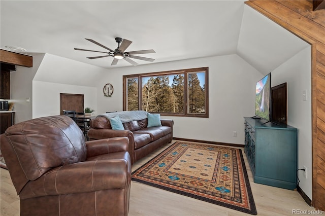 living room with ceiling fan, light wood-type flooring, and lofted ceiling