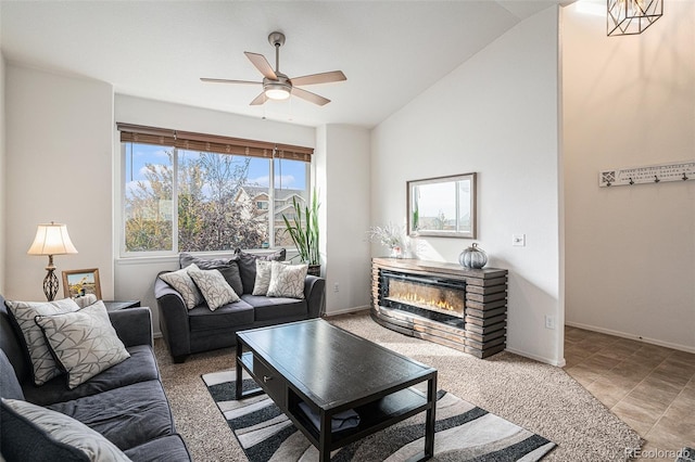 living room featuring ceiling fan and vaulted ceiling