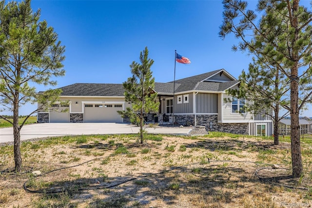 229 High Meadows Loop, Elizabeth, CO 80107 - ranch-style home with stone siding, board and batten siding, a garage, and concrete driveway