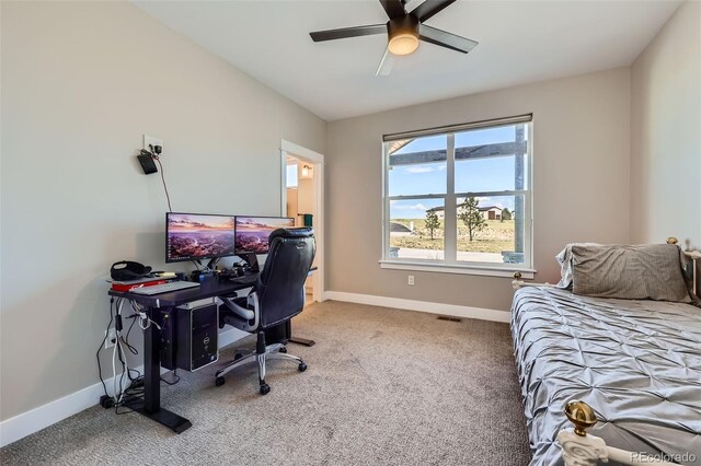 229 High Meadows Loop, Elizabeth, CO 80107 - bedroom featuring light carpet, a desk, and a ceiling fan