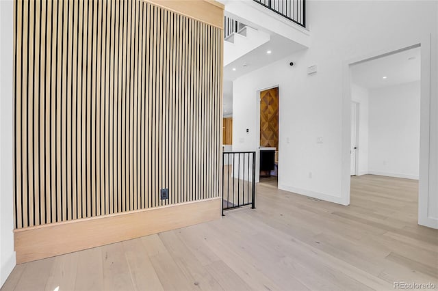 1491 S York St, Denver, CO 80210 - unfurnished room with wood finished floors, a high ceiling, and recessed lighting